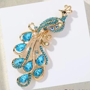 Elegant Gold and Blue Peacock Brooch